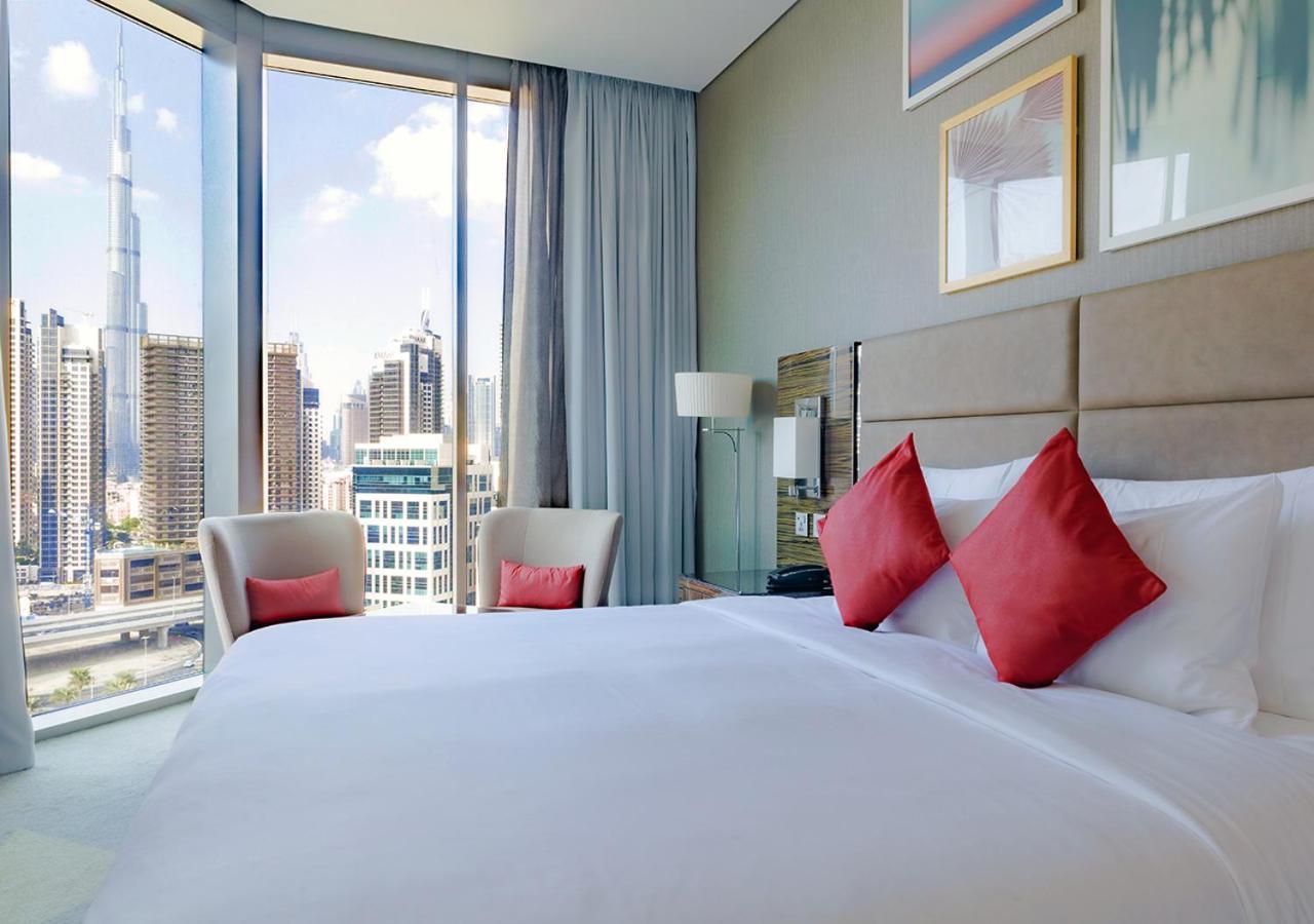 Hyde Hotel Dubaj Exteriér fotografie A bedroom at the Address Downtown Hotel